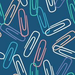 Modern seamless pattern with colorful paper clips on blue background.