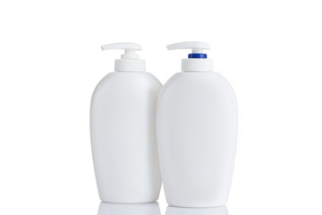two cosmetic mock up bottles isolated on white background. jar for skincare product cream, shampoo, conditioner, foam. Empty, clean white plastic bottles with pump dispenser