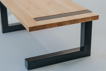 wooden table with metal legs on white background