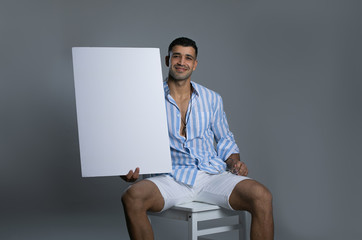 Italian  man holds a white board