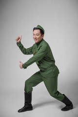 guy in uniform on gray background