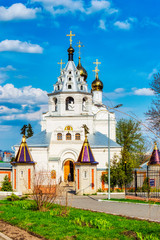 Bryansk, Russia-April 2018: Peter and Paul monastery. The old snow-white Church of the Holy mother of God against the blue summer sky.