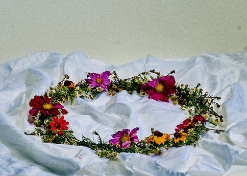 Colorful floral garland on white silk