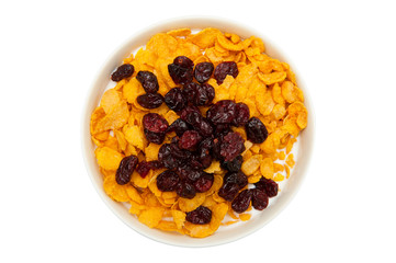 Healthy breakfast. Milk, cornflakes and dried cranberries in bowl isolated on white background 