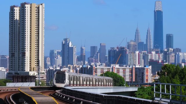 KUALA LUMPUR, MALAYSIA - FEBRUARY 21, 2020: Malaysia MRT (Mass Rapid Transit) train with the background of Kuala Lumpur city. MRT is a transportation for the future generation.