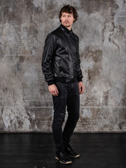 Obraz premium Full length studio portrait of attractive young man. Young Male Fashion Model Posing In Casual Outfit. 