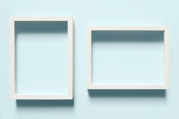 Close-up of white frames on light blue background