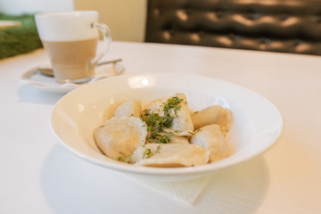 delicious dumplings with herbs and coffee