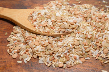 Assortment of various kinds grains in wooden spoon, healthy diet