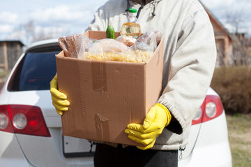 male volunteer delivers food to   village, close up on hands