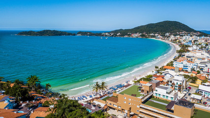 Fototapeta na wymiar Bombinhas - SC - Brazil. View to Bombinhas beach. Aerial panoramic view touristic beach of Brazil