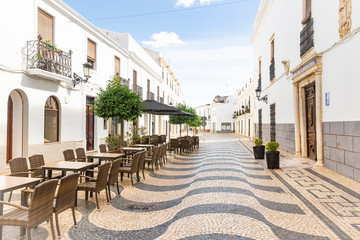 a cobbled street with typical white houses in Oliven&ccedil;a (Olivenza) town, province of Badajoz, Extremadura, Portugal/Spain