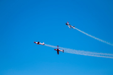 Air Acrobatic flight reciprocating aircraft Israeli group showing flying skills on the Parade of Independence Day of Israel