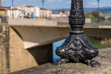 The black ornate lamppost in renaissance style. Florence, Italy