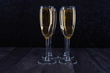 four glasses filled with champagne