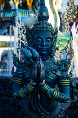 A beautiful view of Wat Rong Suea Ten, the Blue Temple at Chiang Rai, Thailand.