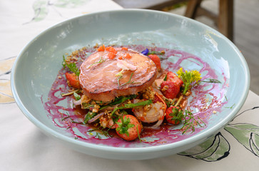 grilled pork ham topped with spicy mixed fruit salad and Strawberry Sauce