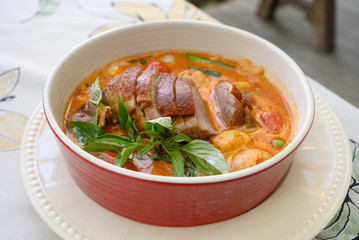 Kaeng Pled Ped Yang (Roasted Duck in Red Curry with tomato,pineapple,Lychee prepared in coconut milk).