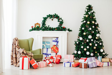 Christmas tree with festive gifts decor of the interior of the new year