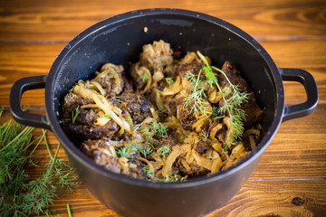 Beef liver fried with onions and herbs