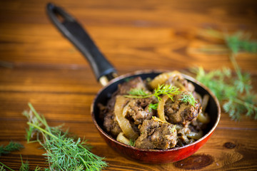 Beef liver fried with onions and herbs