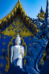 A beautiful view of Wat Rong Suea Ten, the Blue Temple at Chiang Rai, Thailand.