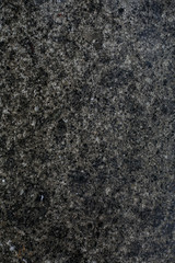 Dark grey stone background. Granny texture of monochrome marble surface without objects. 
