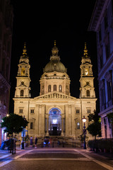 Fototapeta na wymiar A view leading up to St. Stephen's Basilica as the evening passes in Budapest, Hungary