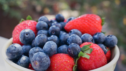 Blueberry strawberry fresh forest fruits wet close up