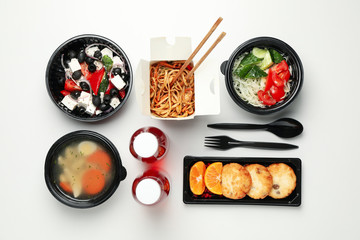 Flat lay with takeaway food on white background. Food delivery