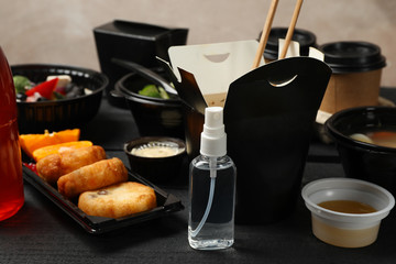 Food delivery. Food in takeaway boxes on wooden table