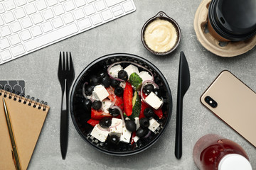 Food delivery. Food in takeaway box on gray background