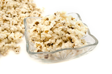 popcorn in a plate on a white background.