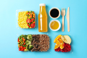 Food delivery. Food in takeaway boxes on blue background