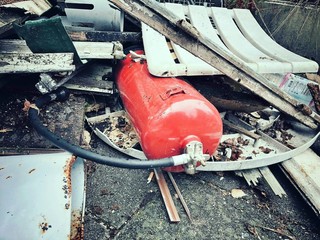 an old .fire extinguishers on a dump