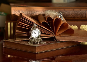 antique books and clock