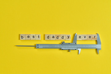 Inscription Fathers Day with different tools on yellow background. Wooden letter BEST DADDY EVER...
