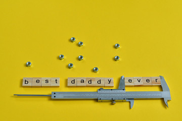 Inscription Fathers Day with different tools on yellow background. Wooden letter BEST DADDY EVER...