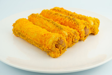 a plate of sausage roll isolated on white background