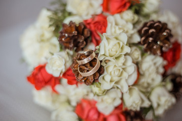 Wedding bouquet with rings. Bridal bouquet with cones.