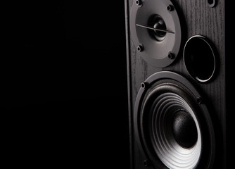 Acoustic sound speakers on black background. Multimedia, audio and sound concept. copy space.