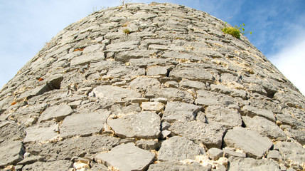 Ruins of an ancient castle in Italy. Wall of the tower.