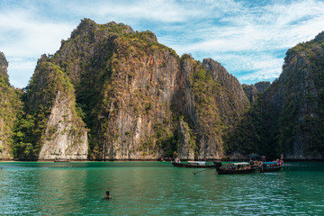 Beautiful tropical island of Koh Phi Phi, Thailand with blue water and green rocky formations