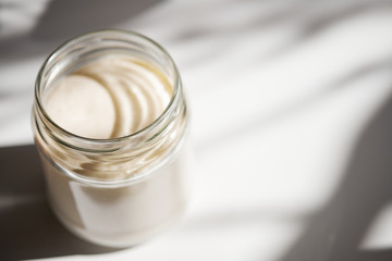 Yeast during fermentation closeup in a glass jar