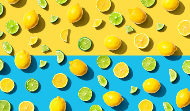 Fresh lemons and limes overhead view - flat lay