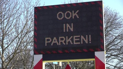 Warning sign to keep 1,5 meters distance in public park in Amsterdam, social distancing to prevent spread of coronavirus
