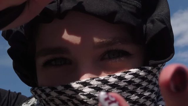 Youn girls eyes in kufiya outdoors
