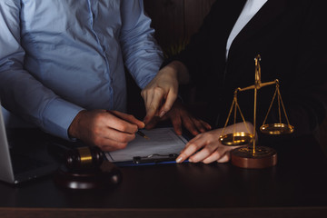 Business - meeting in an office, lawyers or attorneys discussing a document or contract agreement.