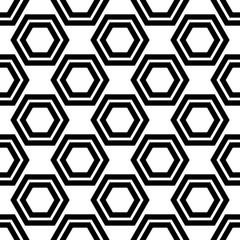 Black hexagons isolated on white background. Monochrome seamless pattern. Horizontal view. Vector graphic illustration. Texture.