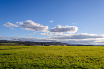 Drummossie Moor on a summer day with a beautiful blue sky: the field is the site of the Battle of Culloden (1746) near Inverness in the Scottish Highlands, Scotland, UK